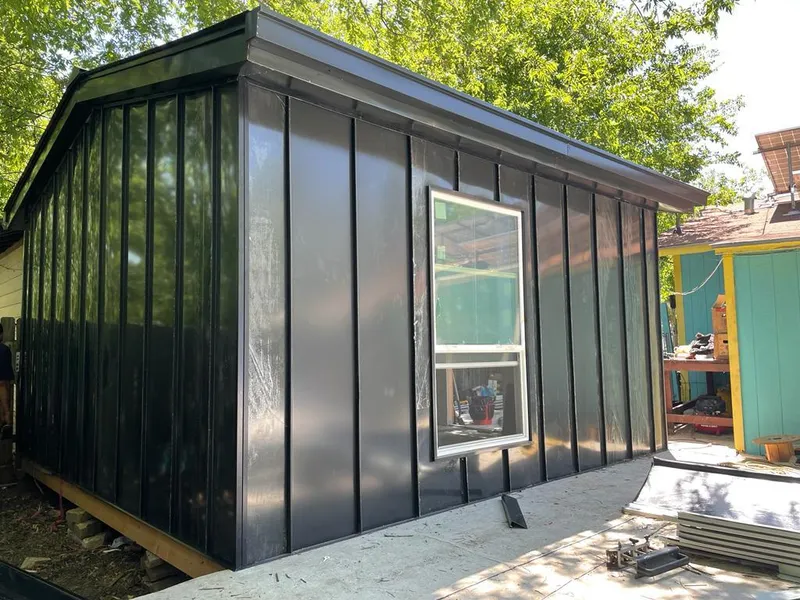 Black standing seam metal wall panels for Roof Inspection in Satsuma